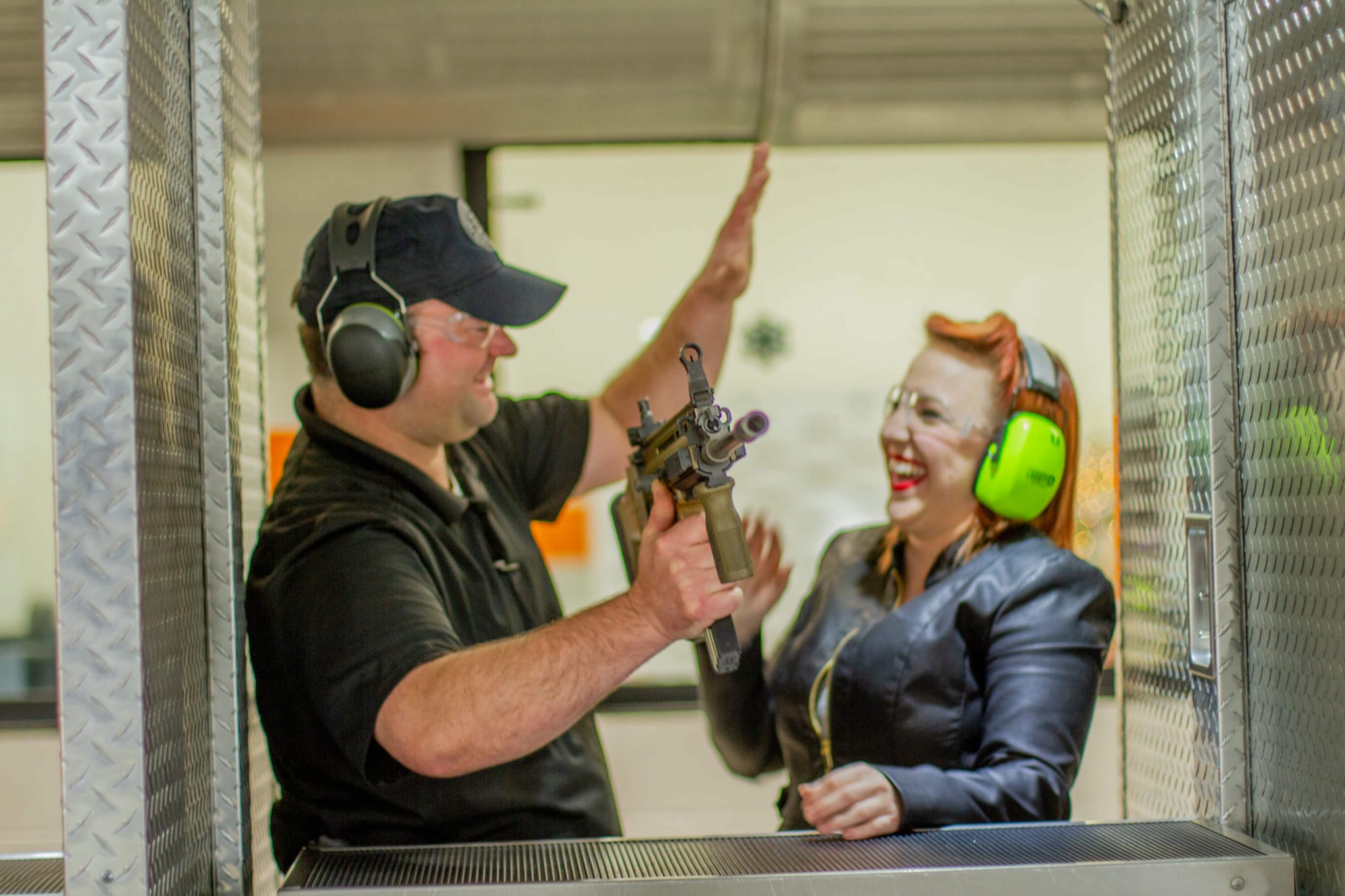 Man and Woman smiling at gun range