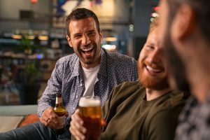 Men laughing at bachelor party in Vegas