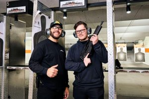 Men smiling at Vegas shooting ranges